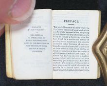 Load image into Gallery viewer, Smallest English Dictionary in the World. MINIATURE BRYCE DICTIONARY IN LOCKET; Publication Date: 1900 CONDITION: VERY GOOD