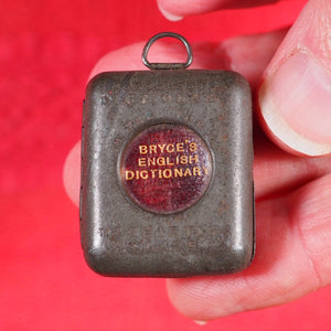 Smallest English Dictionary in the World. >>MINIATURE BRYCE DICTIONARY IN LOCKET<< Publication Date: 1900 CONDITION: GOOD