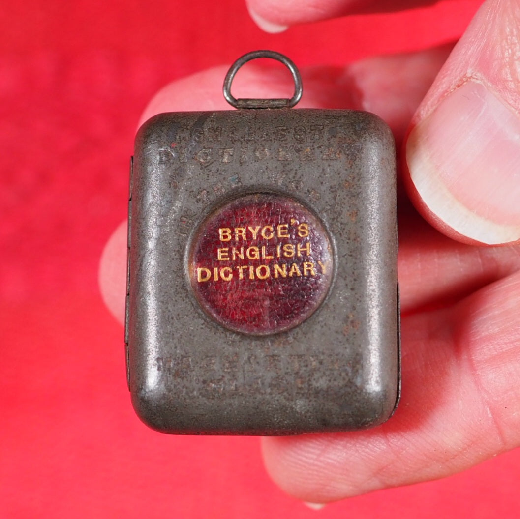 Smallest English Dictionary in the World. >>MINIATURE BRYCE DICTIONARY IN LOCKET<< Publication Date: 1900 CONDITION: GOOD