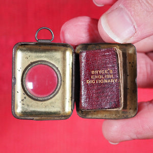 Smallest English Dictionary in the World. >>MINIATURE BRYCE DICTIONARY IN LOCKET<< Publication Date: 1900 CONDITION: GOOD