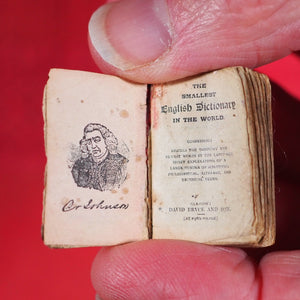 Smallest English Dictionary in the World. >>MINIATURE BRYCE DICTIONARY IN LOCKET<< Publication Date: 1900 CONDITION: GOOD
