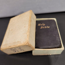 Load image into Gallery viewer, Holy Bible c1914  3/4" x 1 1/4"  Bound in black leather with gilt title to front cover and spine. Gilt edges.  Contained in an unmarked cardboard box
