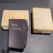 Load image into Gallery viewer, Holy Bible c1914  3/4" x 1 1/4"  Bound in black leather with gilt title to front cover and spine. Gilt edges.  Contained in an unmarked cardboard box
